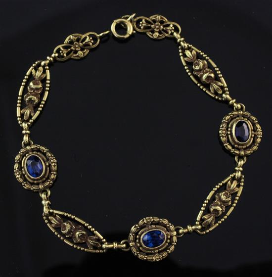 An early 20th century French 18ct gold blue doublet set bracelet, 7.5in.